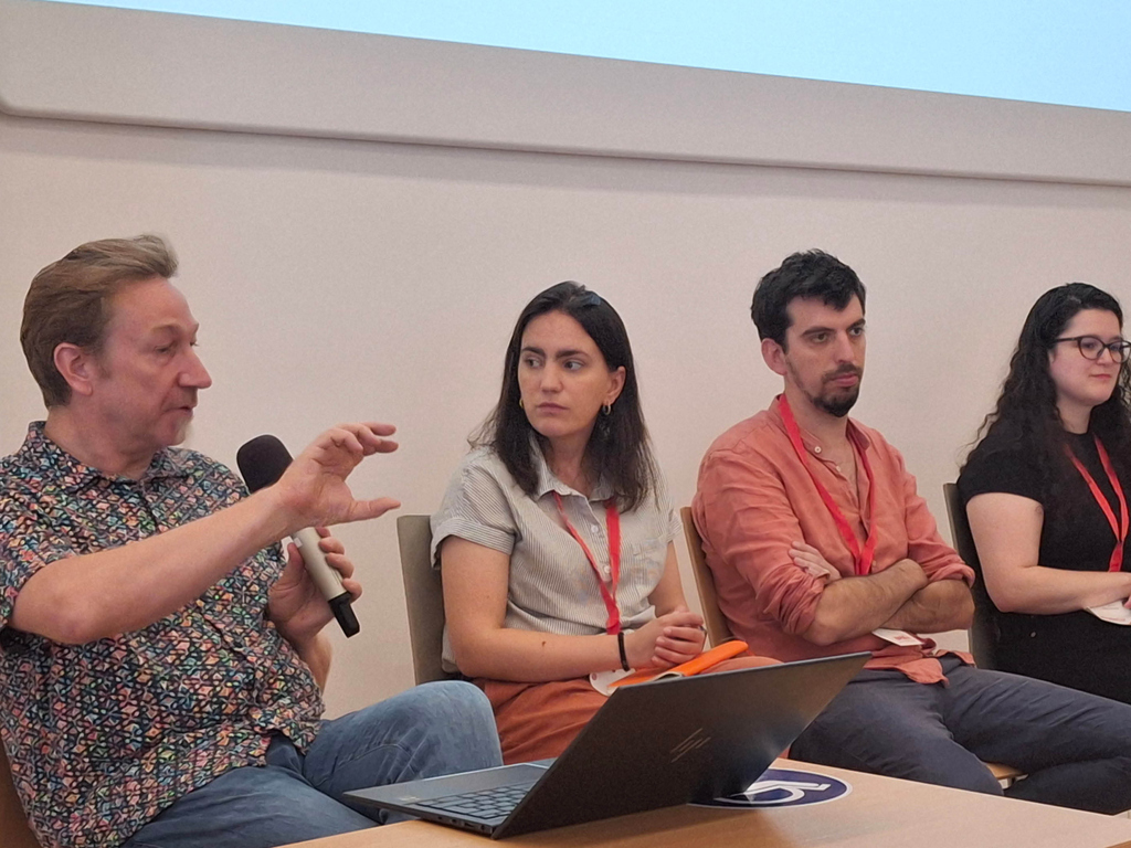 People sitting and talking at conference